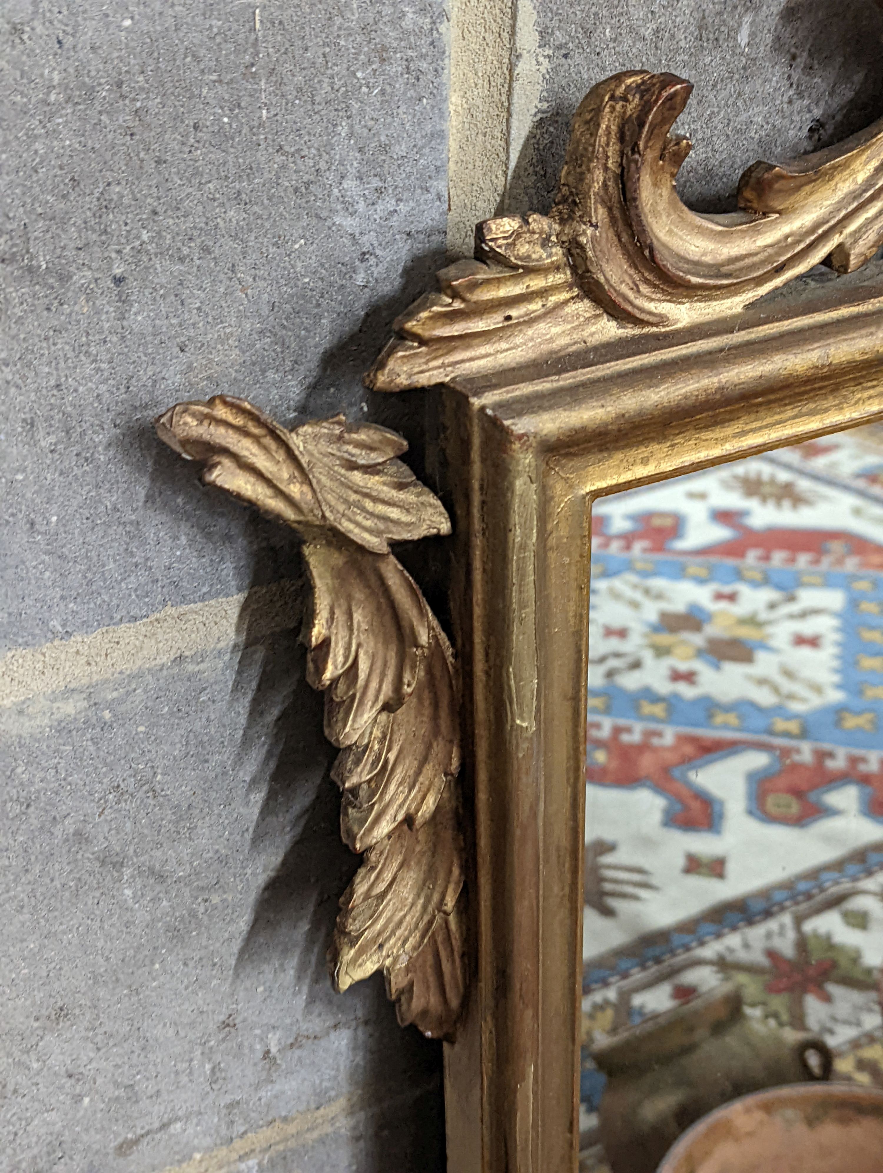 A 1930's French carved giltwood wall mirror, width 80cm